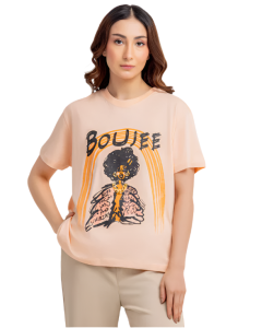 Woman wearing a beige t-shirt with a graphic design on a white background