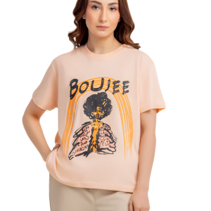 Woman wearing a beige t-shirt with a graphic design on a white background